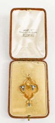 Lot 37 - An Edwardian 15ct gold, seed pearl and blue...