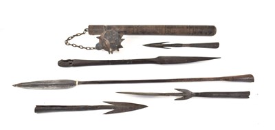 Lot 304 - A collection of Tribal spear heads, the larges...