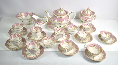 Lot 130 - A Victorian pink and gold part tea set...