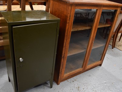 Lot 449 - An oak glazed bookcase, with two doors and two...