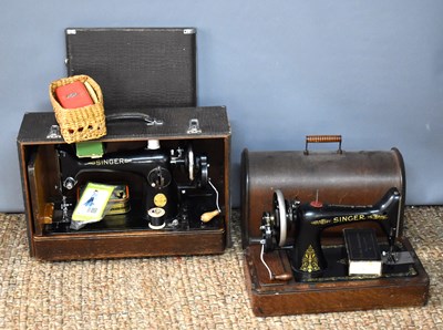 Lot 185 - Two vintage Singer Sewing machines both cased...