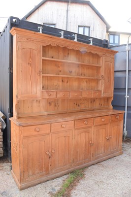 Lot 490 - A large country house pine dresser and rack,...