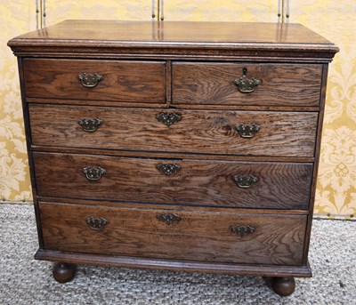 Lot 491 - An 18th century oak chest of drawers, with two...