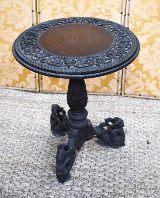 Lot 468 - An Indonesian hardwood carved table, the...