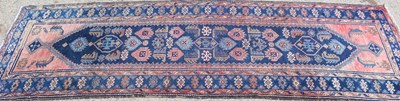 Lot 504 - An antique Middle Eastern blue and pink ground...