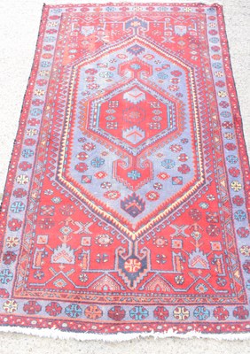 Lot 477 - An antique Middle Eastern, likely Iranian red...