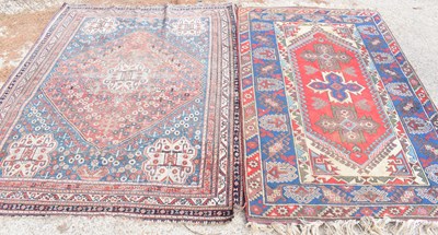 Lot 480 - Two antique Persian rugs, one with diamond...