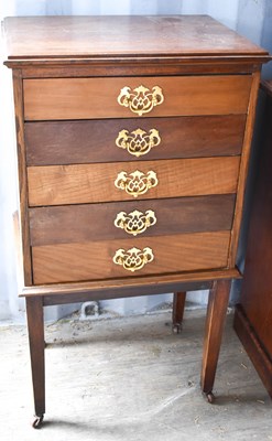 Lot 437 - A 20th century mahogany music cabinet, with...