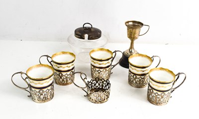 Lot 212 - A set of five silver coffee can holders, with...