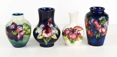 Lot 3 - Four small Moorcroft vases, in various pattern...