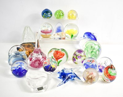 Lot 127 - A selection of glass paperweights of various...