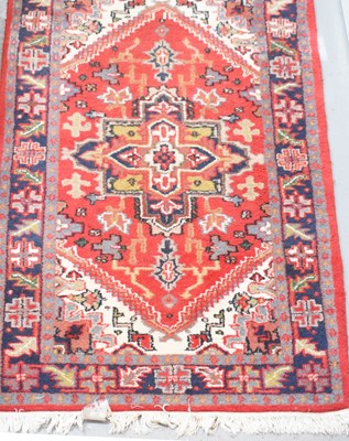 Lot 479 - A handmade Indian rug, red ground with...