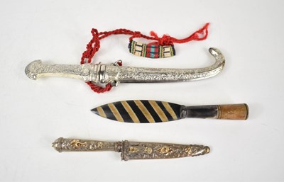 Lot 187 - A Peruvian white metal dagger, inlaid with...