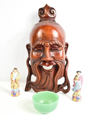 Lot 186 - A Chinese hardwood carved mask, jadite bowl,...