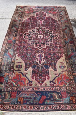 Lot 481 - A Middle Eastern wool rug, red ground with...