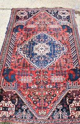 Lot 478a - A Middle Eastern wool rug, red ground with...