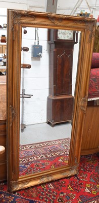 Lot 335a - A large wall mirror with bevelled edge glass...