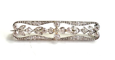 Lot 19 - An Art Deco platinum and diamond bar brooch,...