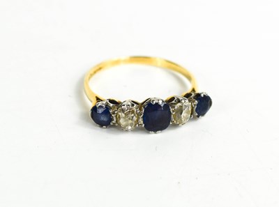 Lot 134 - An 18ct gold, diamond and sapphire ring, with...