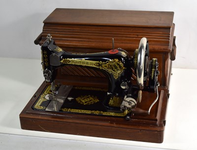 Lot 351 - A Singer sewing machine and case, bearing...