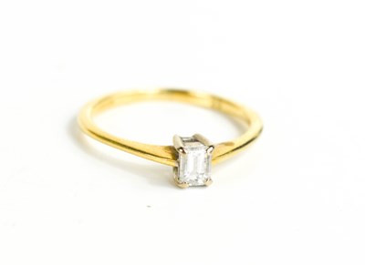 Lot 53 - An 18ct gold and diamond ring, the baguette...