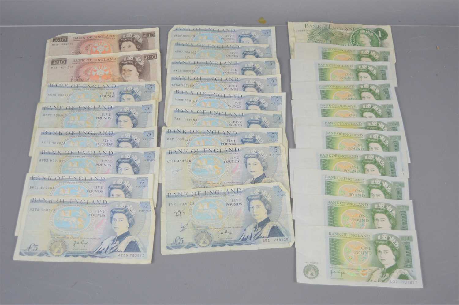 Lot 439 - A group of British banknotes to include ten...