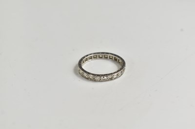 Lot 273 - A platinum and diamond full eternity ring,...