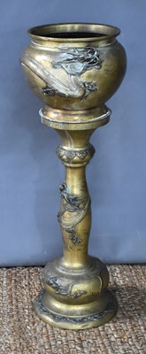 Lot 115 - A Japanese Meiji period brass jardiniere on...