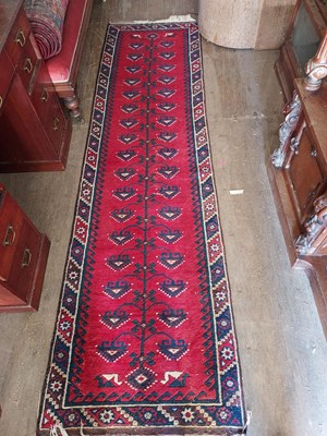 Lot 498 - A vintage Persian wool runner, red ground,...