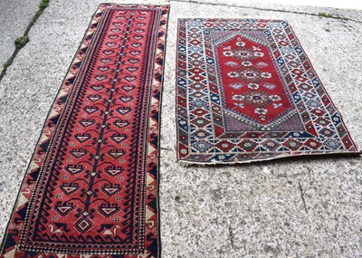 Lot 505 - A Middle Eastern wool runner 287cm by 79cm...