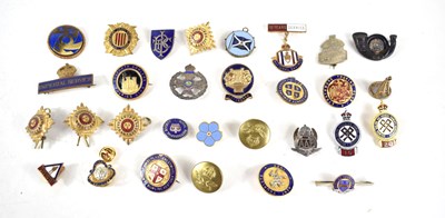 Lot 337 - A collection of enamel badges, buttons and...