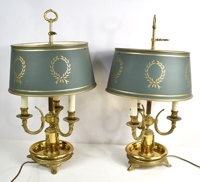 Lot 427 - A pair of French Bouillotte gilt metal table...