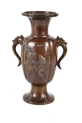 Lot 2 - An oriental bronze vase with twin elephant...