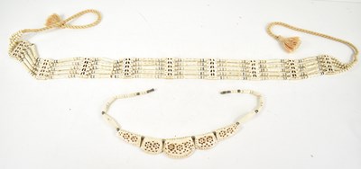 Lot 34 - A large carved bone five strand necklace, 73cm,...