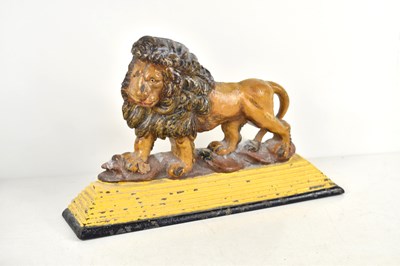 Lot 404 - An antique cast iron painted doorstop modelled...