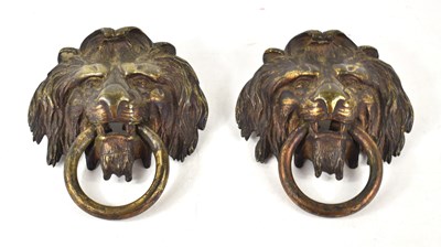 Lot 253 - A pair of Georgian brass lions head door...