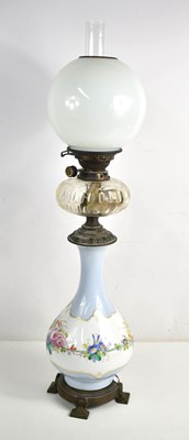 Lot 428 - A Victorian porcelain oil lamp with glass...