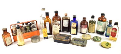 Lot 240 - A selection of chemist bottles and tins to...