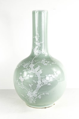 Lot 11 - A 20th century celadon pale green bottle vase,...