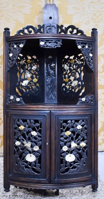 Lot 111 - A Chinese vintage hardwood corner cupboard,...