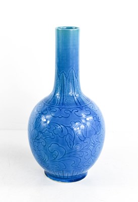 Lot 12 - A Chinese Qing Dynasty stoneware bottle vase...