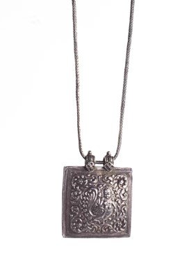 Lot 33 - An Indian white metal pendant necklace, the...