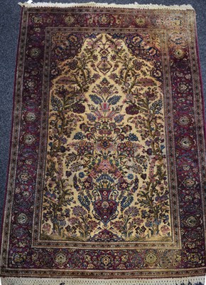 Lot 512 - A Persian silk & wool rug, with a deep purple...