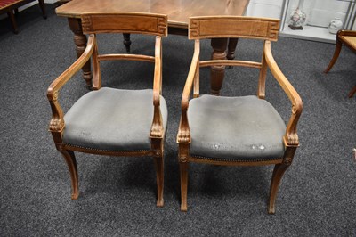 Lot 513 - A pair of pale oak armchairs, the arms...