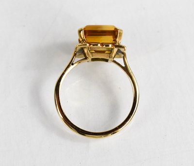Lot 19 - A 9ct gold and emerald cut citrine dress ring,...