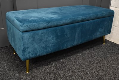 Lot 516 - A teal velvet upholstered ottoman / blanket...