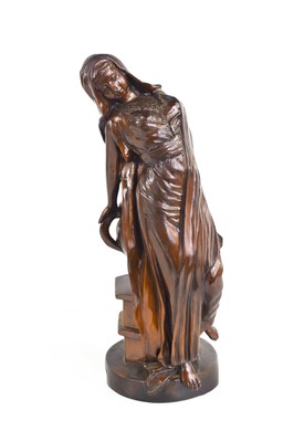 Lot 146 - A 20th century bronzed metal figure of a lady...