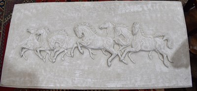 Lot 194 - A concrete plaque depicting seven galloping...