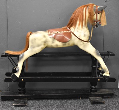 Lot 360 - A vintage painted rocking horse in dapple grey,...