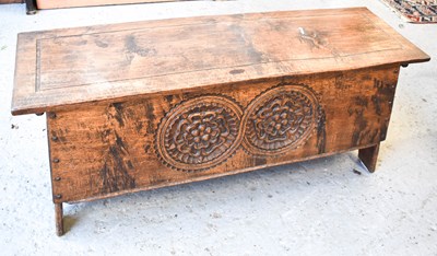 Lot 540 - An Arts & Crafts oak carved coffer, the canted...